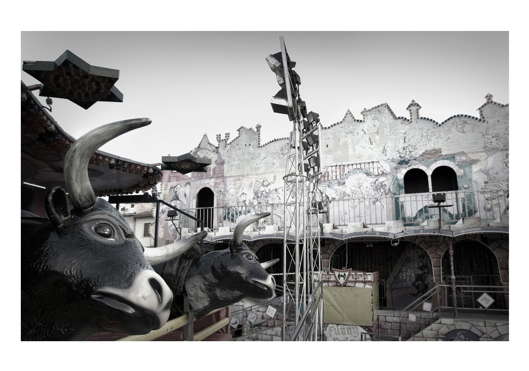 Two bulls and a plastic background in an amusement park